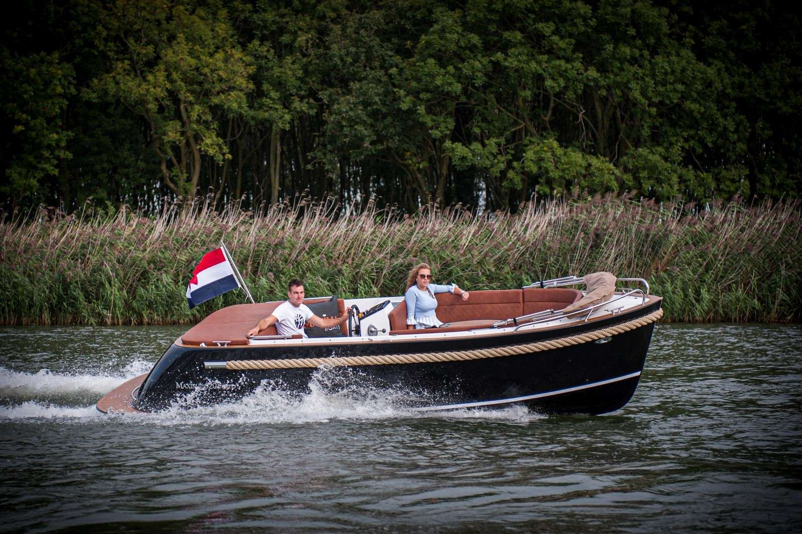 Maxima 620 electric sloop tender with rope fender and swim platform